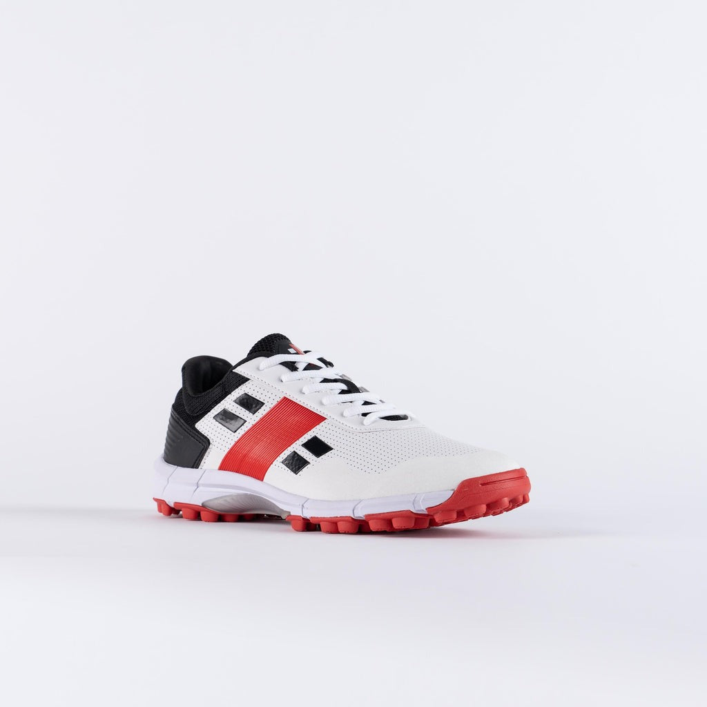 White sports shoe with red accents Gray Nicolls Velocity 4.0 cricket shoes with breathable mesh upper
