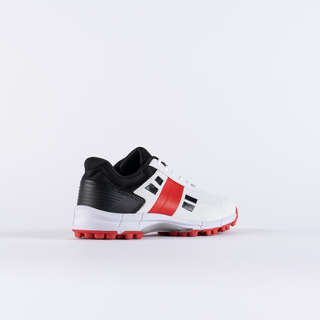 White sports shoe with black and red accents Gray Nicolls Velocity 4.0 lightweight cricket shoes for indoor training