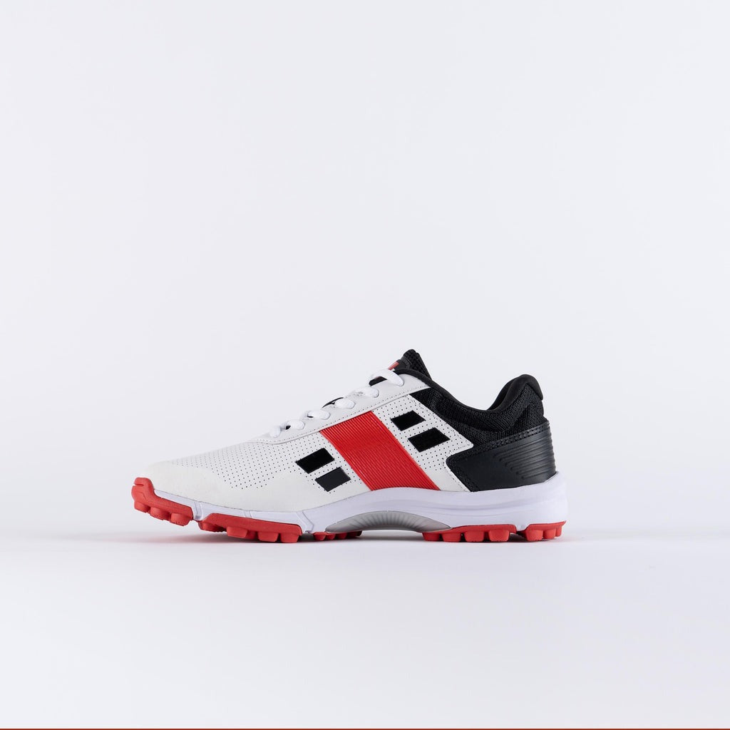 White sports shoe with red and black accents Gray Nicolls Velocity 4.0 men's cricket shoes with superior grip