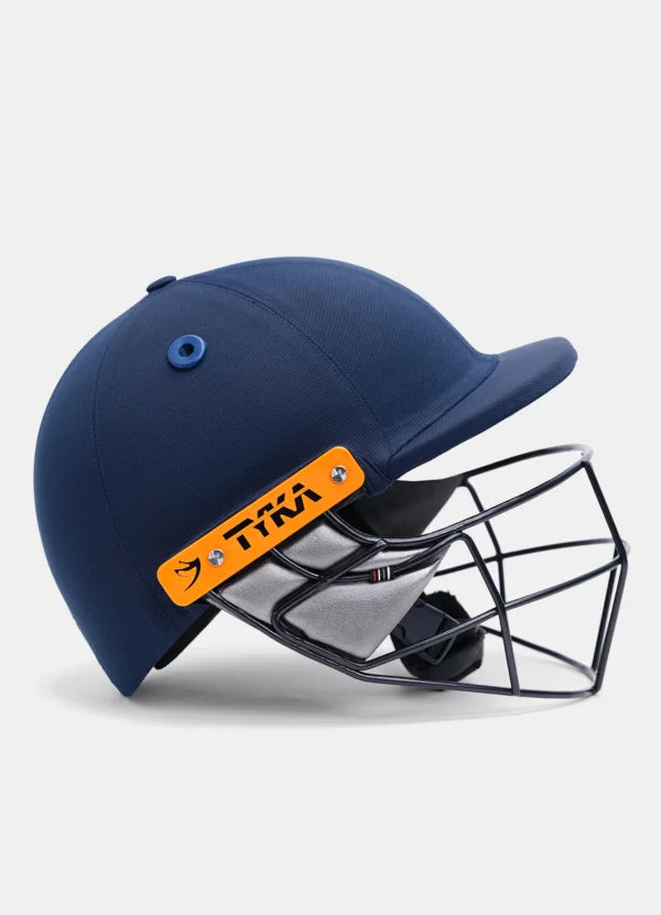 Junior batter wearing the Tyka Atlas youth cricket helmet during a net session