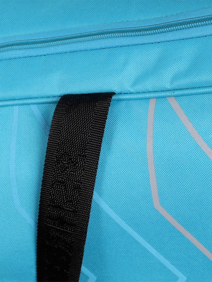 Close-up of a blue bag with a black strap Shoe compartment of Shrey Kare wheelie cricket kit bag