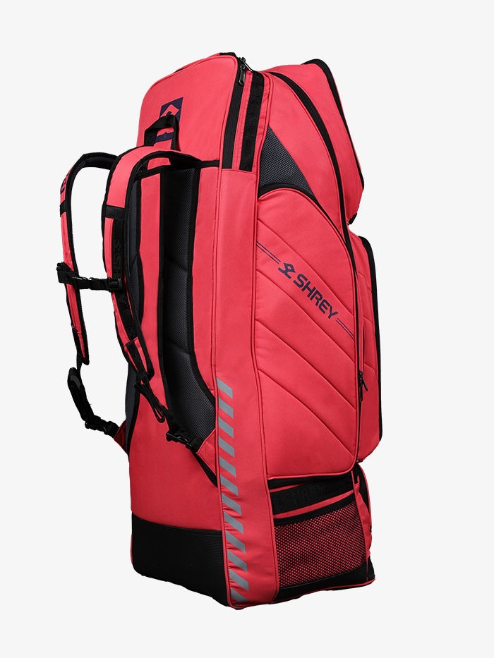 Red and black sports bag Side view of Shrey Legacy Duffle 120 wheelie cricket kit bag with carry handles