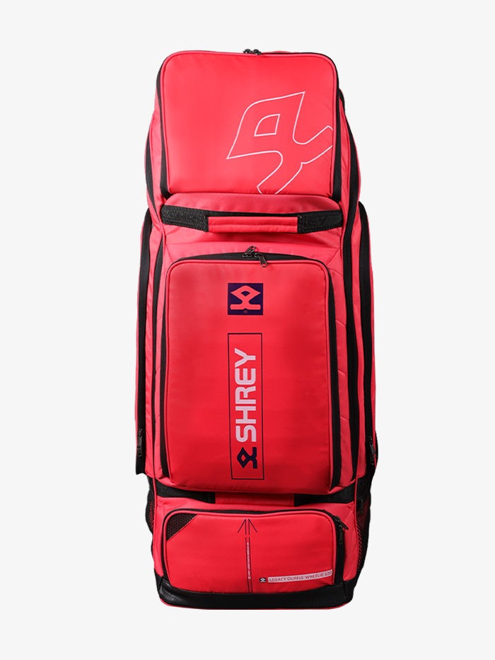 Red sports bag with black accents Close-up of wheels on Shrey Legacy Duffle 120 wheelie cricket kit bag