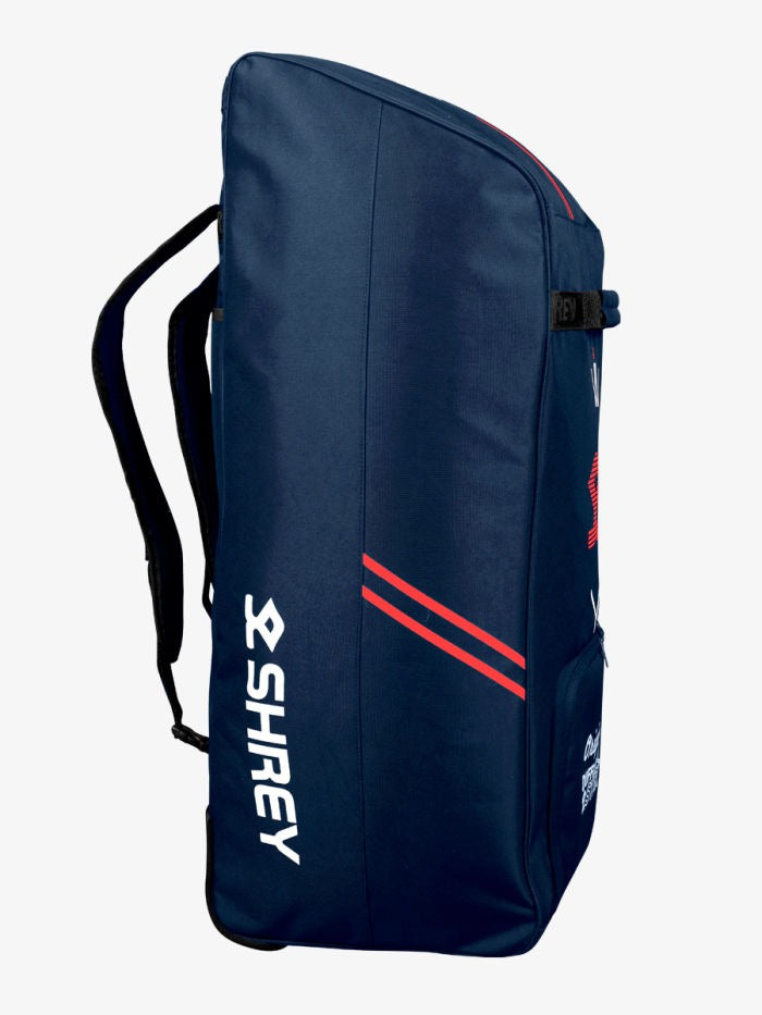 Blue backpack with 'Shirey' Open Shrey Star duffle cricket kit bag showing main compartment