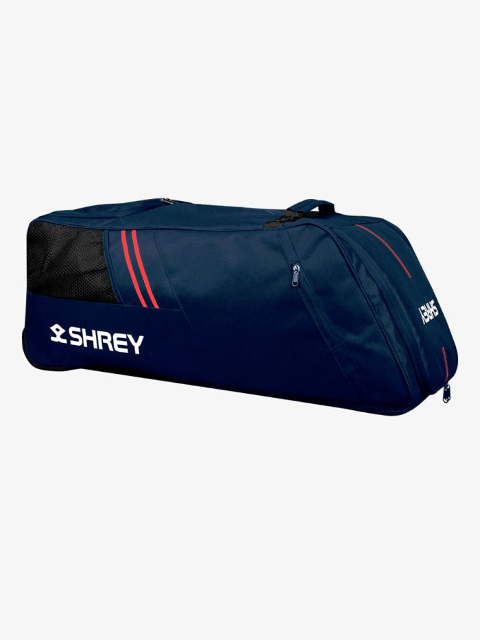 Navy blue sports bag with red accents and 'Shrey' branding on a white background Side view of Shrey Star duffle cricket kit bag with carry handles