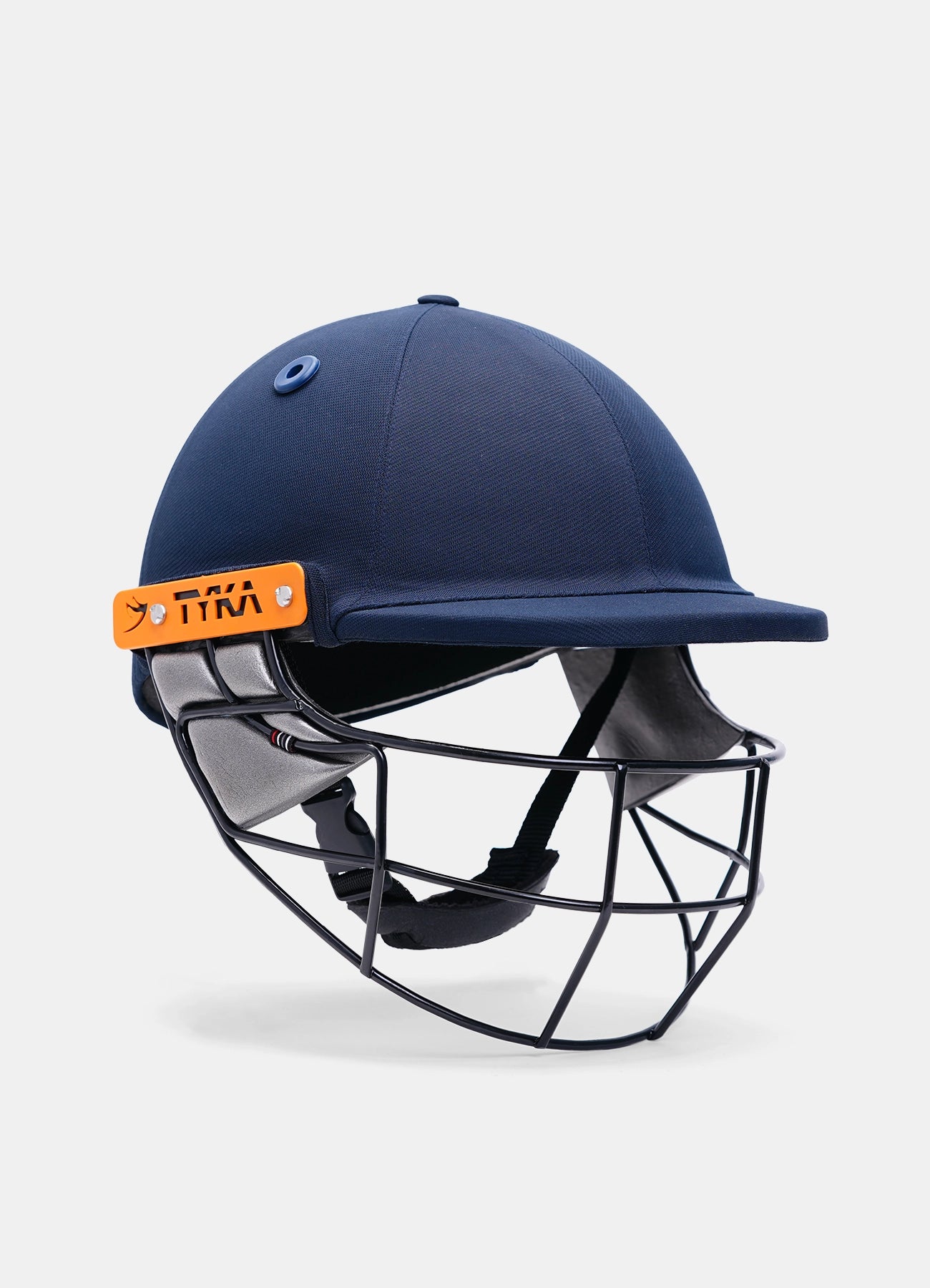 Navy blue cricket helmet with orange Tyka Atlas junior cricket helmet with steel visor photographed on a plain background