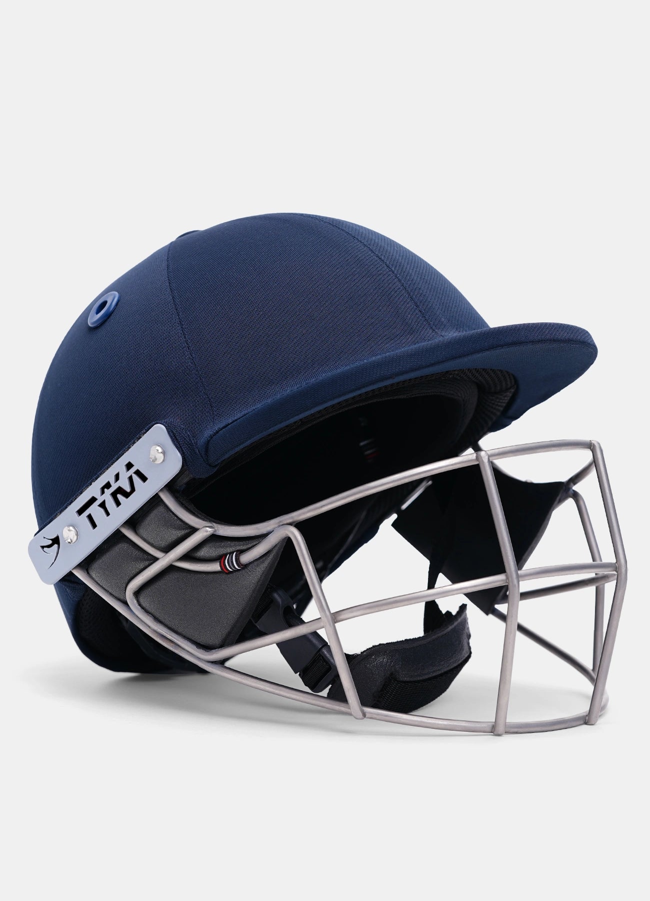 Navy blue cricket helmet with a silver face guard Rear view of the Tyka Force Match cricket helmet showing the back shell